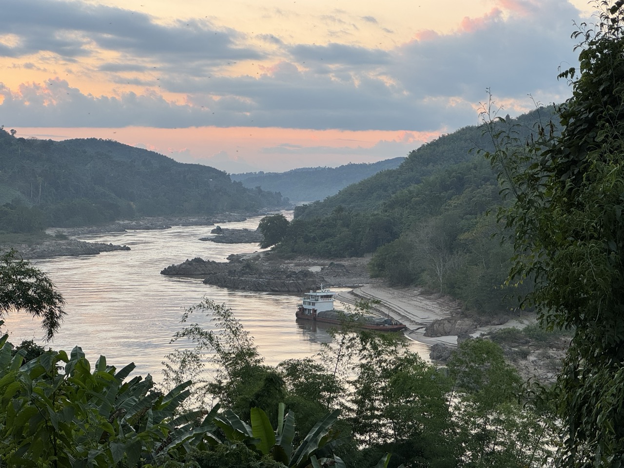 Mekong cargo boat at sunset, the kind that runs through Pak Beng all night