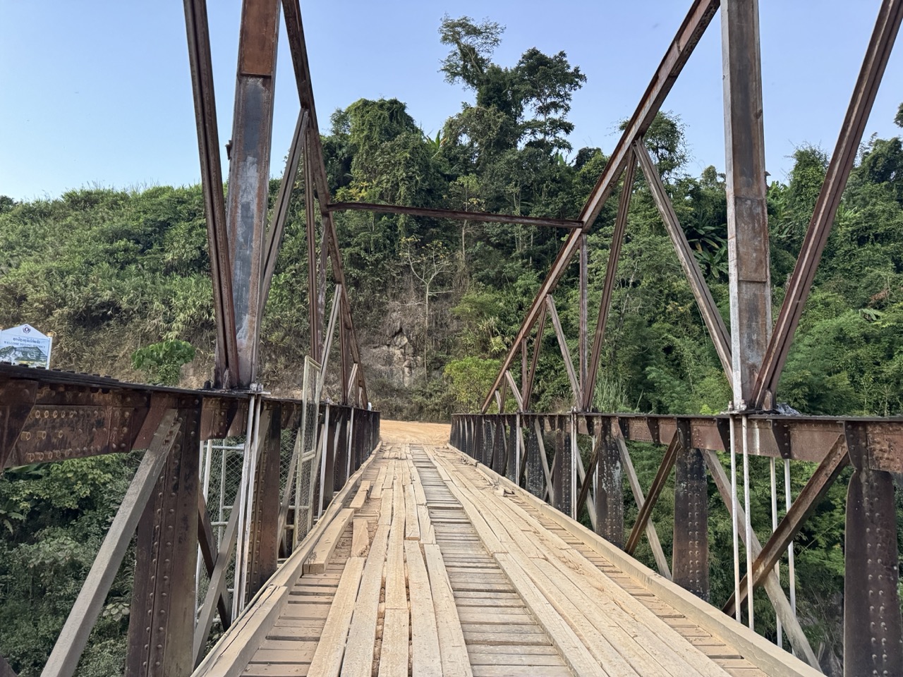 An old iron bridge crossing in rural Bokeo province
