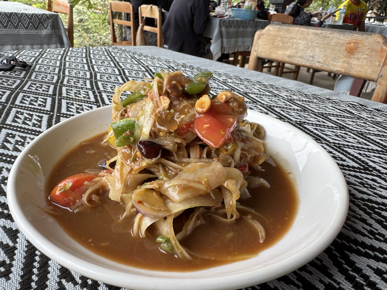 Lao green papaya salad lunch at a riverside restaurant in Nong Khiaw