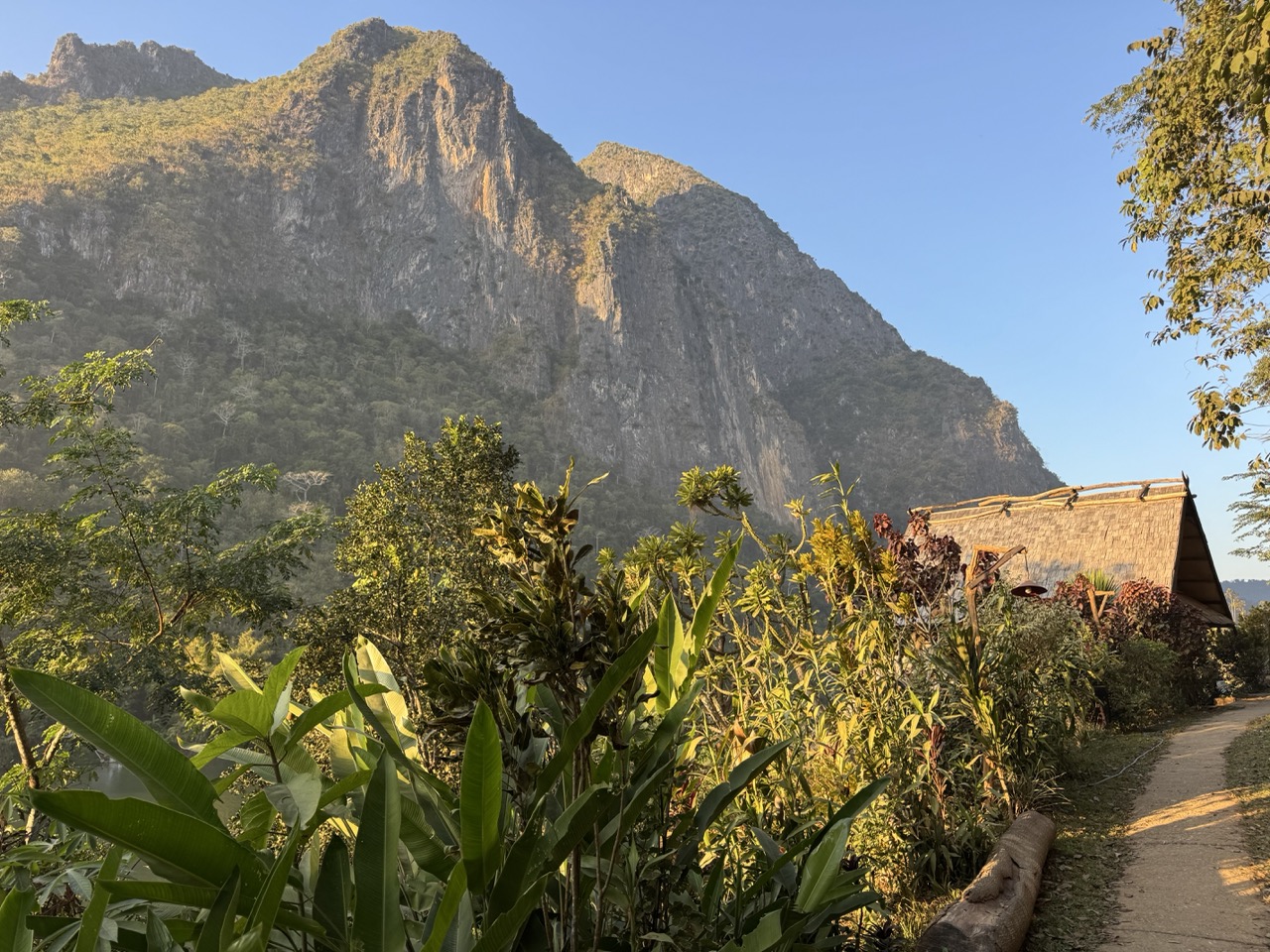 Golden hour view from Pha Daeng Peak over the karst valley around Nong Khiaw